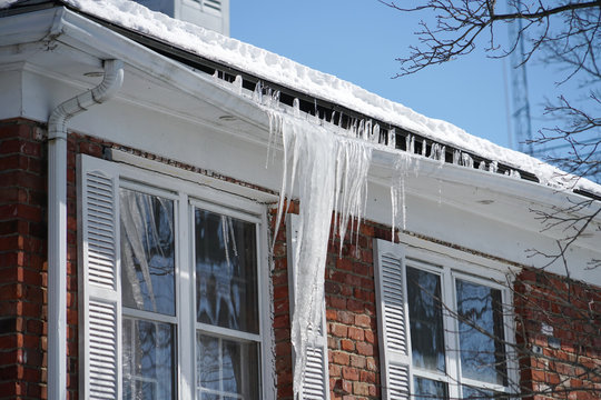 16 Tips to winterize your home and save on electric bill Tulsa. Frozen gutters.